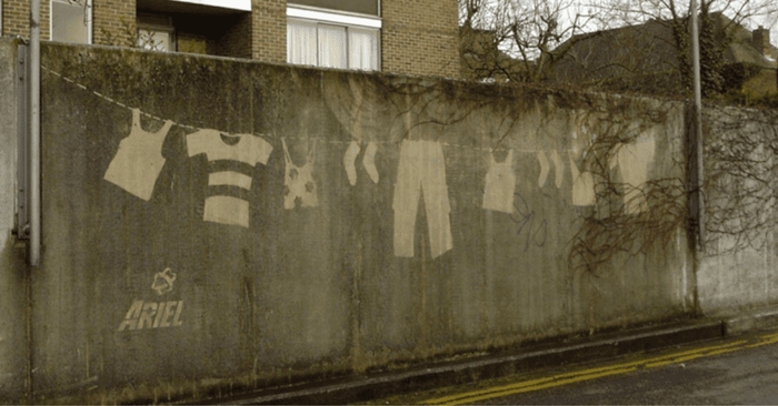 reverse graffiti example of a clothes line