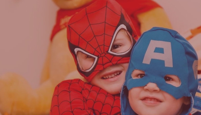 kids in superhero costumes at a child-friendly coworking space