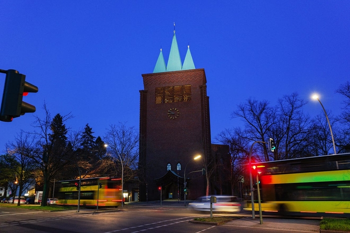 The Cross Church at night on a busy working day.