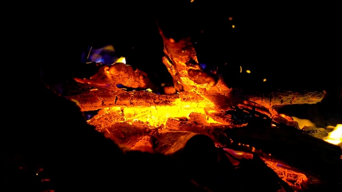 a close up of a fire in the dark