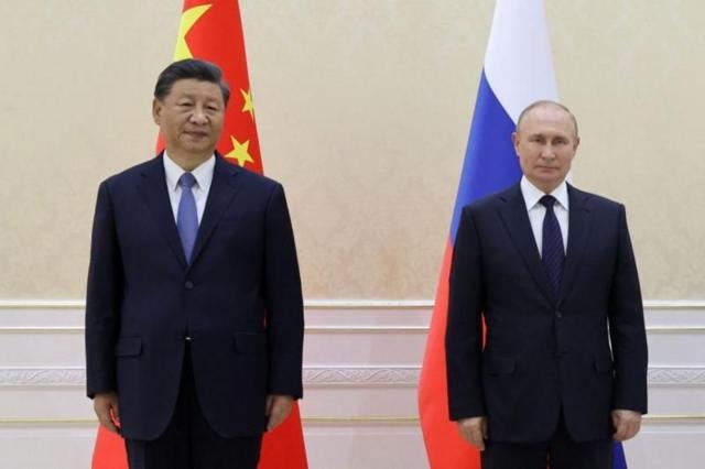 Підпис до фото,Путін та Сі Цзіньпін на зустрічі в Самарканді 15 вересня 2022 року