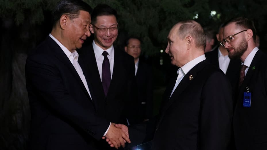 Russian President Vladimir Putin and Chinese President Xi Jinping bid farewell at the end of talks in Beijing, China May 16, 2024. 