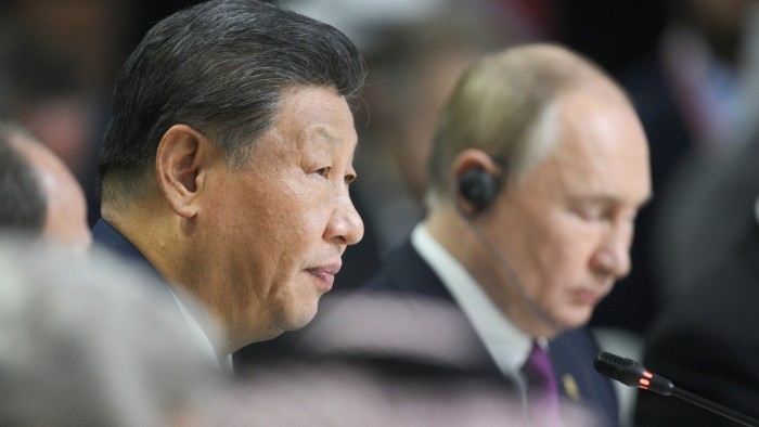 Xi Jinping and Vladimir Putin attend the plenary session of the Outreach/Brics Plus meeting in Kazan, Russia