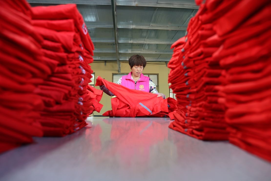 A worker produces export clothing in a workshop of a clothing foreign trade enterprise in Binzhou City, China, on April 23.