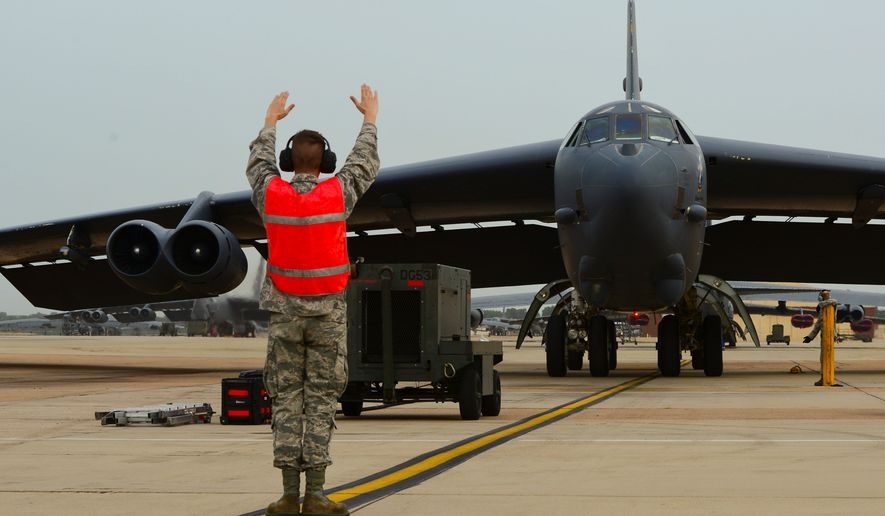 A B-52H Stratofortress is marshalled to a stop on Barksdale Air Force Base, La., July 2, 2015. Two B-52s flew an approximate 44-hour roundtrip mission to Australia where they integrated with Royal Australian Air Force ground forces in the region to conduct a conventional weapons exercise and perform a low approach at RAAF Base Tindal. (U.S. Air Force photo/Senior Airman Benjamin Raughton)