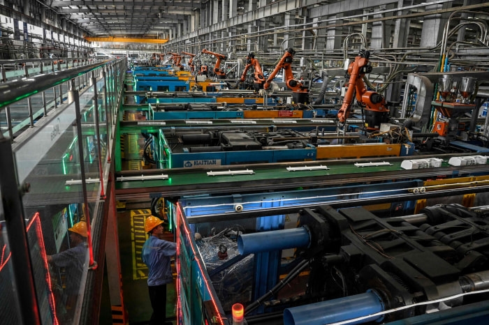 KUKA robotic arms on an air conditioner assembly line at a Midea factory in Guangzhou, China.