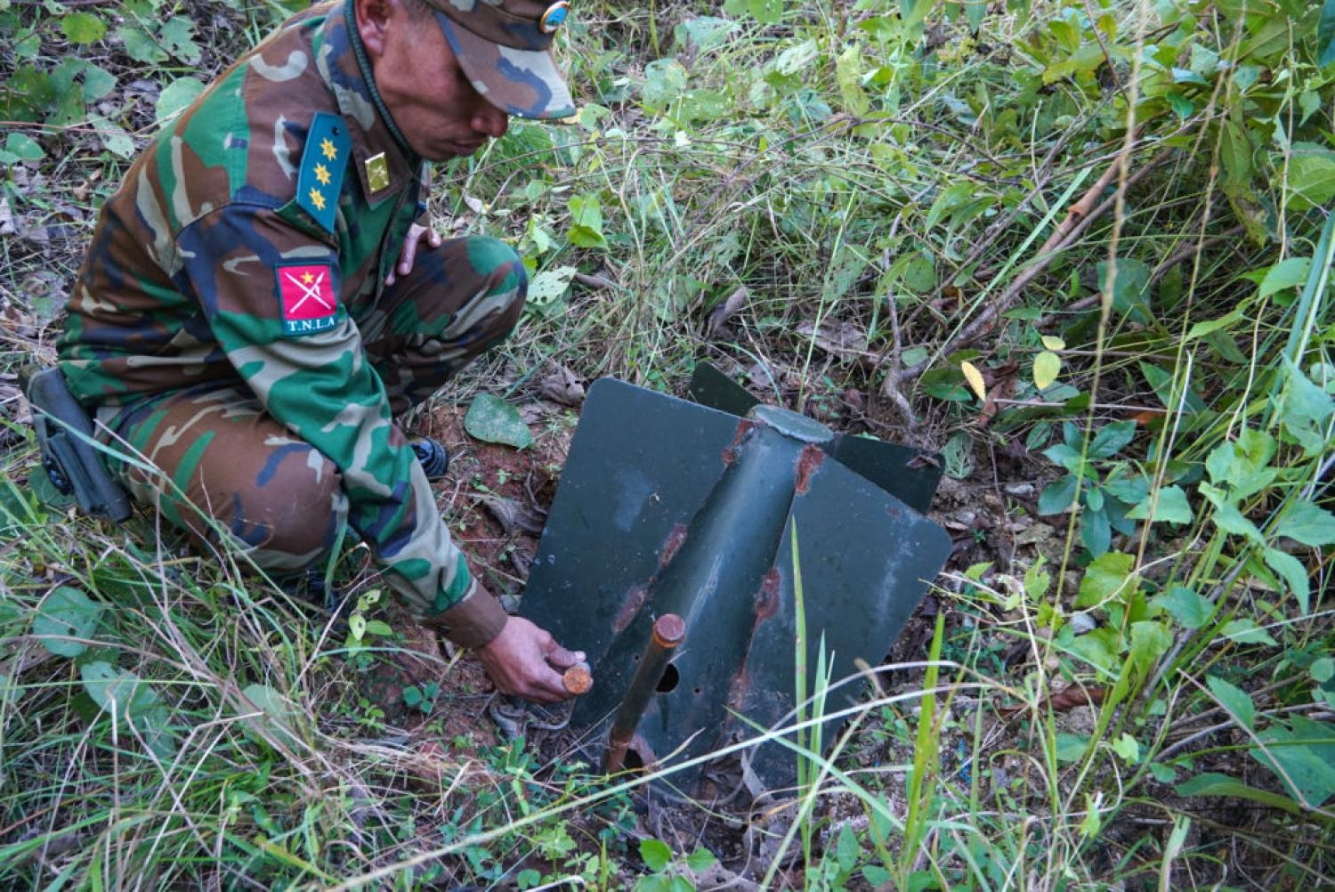 A member of Ta'ang National Liberation Army (TNLA) handling a Myanmar military's unexploded ordnance in Mantong town, northern Shan State. Landmines and unexploded munitions claimed more victims in Myanmar than in any other country last year (Getty)