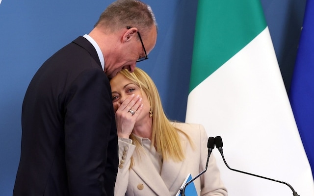 Friedrich Merz, German chancellor, towers over Giorgia Meloni, Italian PM, as they sign their partnership pact 