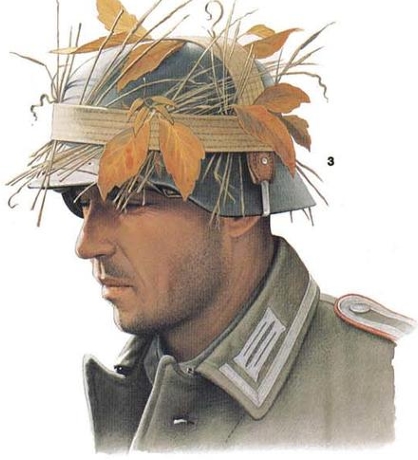 Рослиність причіплена до шолому за допомогою ременю від хлібної сумки (Brotbeutel)