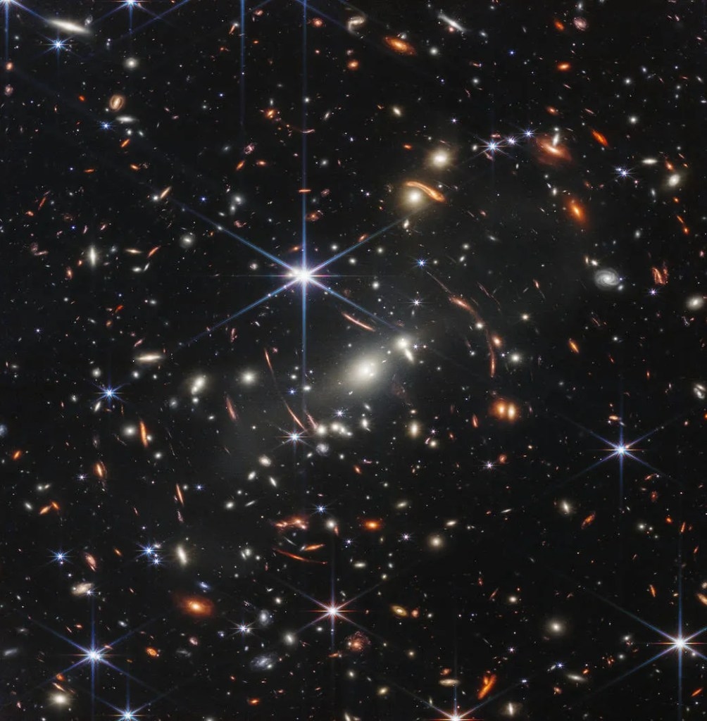 Thousands of galaxies flood this near-infrared image of galaxy cluster SMACS 0723. High-resolution imaging from NASA’s James Webb Space Telescope combined with a natural effect known as gravitational lensing made this finely detailed image possible. Space Telescope Science Institute : NASA, ESA, CSA, STScI
