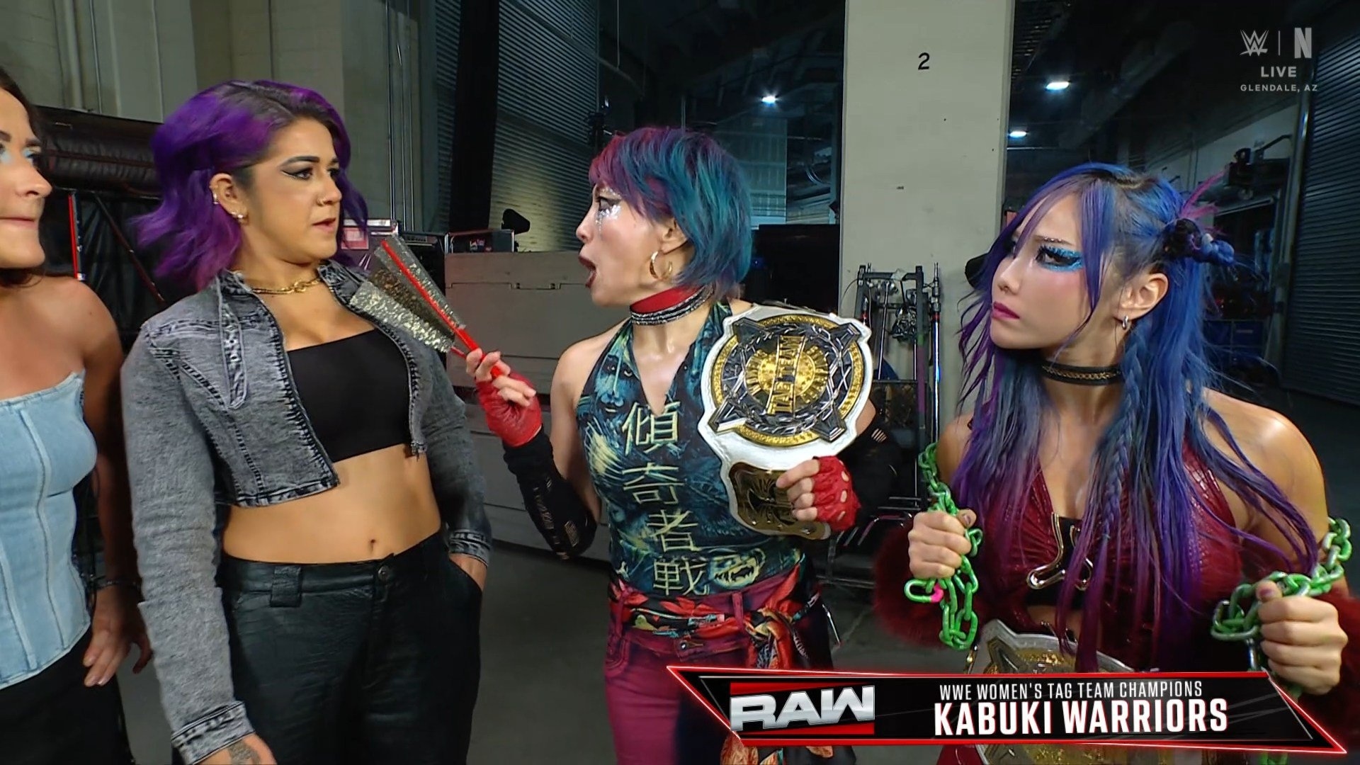 May be an image of text that says 'LIVE 傾 RAW Maл WWE WWEWOMEN'S WOMEN' EWOMEN'STACTEAN.CHAMPIONS TAG TEAM CHAMPIONS KABUKI WARRIORS'