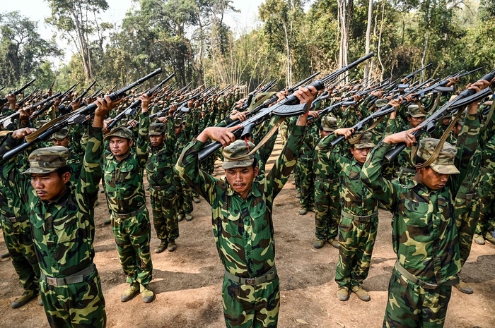 In this photo taken on 8 March 2023, members of the ethnic rebel group Ta'ang National Liberation Army (TNLA) take part in a training exercise at their base camp in the forest in Myanmar's northern Shan State. (AFP)