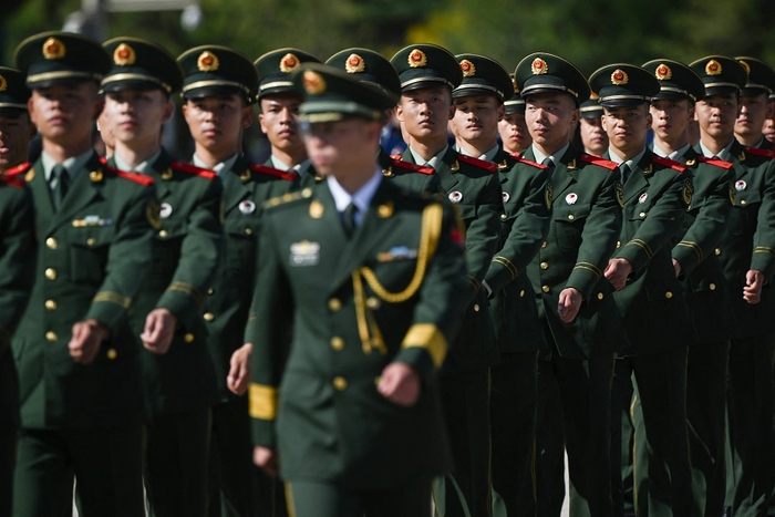 Chinese soldiers march in formation in Beijing’s Tiananmen Square on 30 September 2023. (Pedro Pardo/AFP)