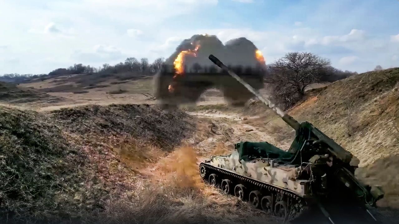 A Russian 152-mm gun fires toward Ukrainian positions