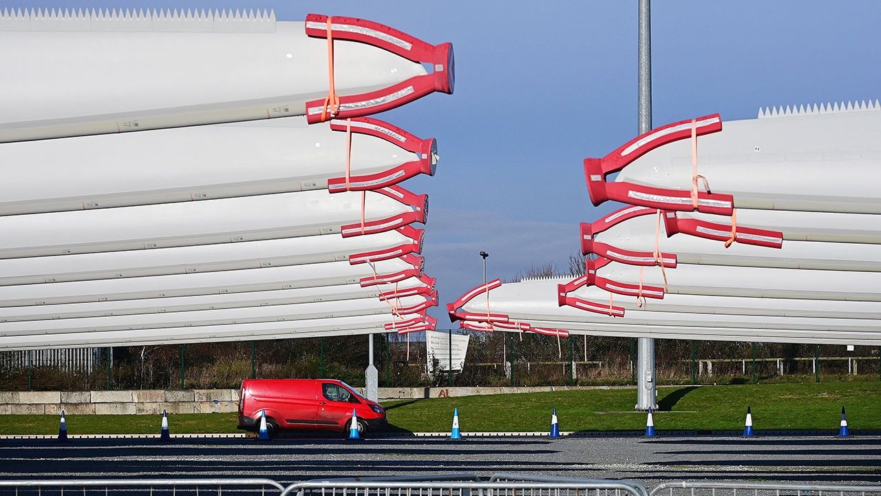 Wind turbine blades are stored on the quayside ready for shipping at the Siemens Gamesa blade factory in Hull.