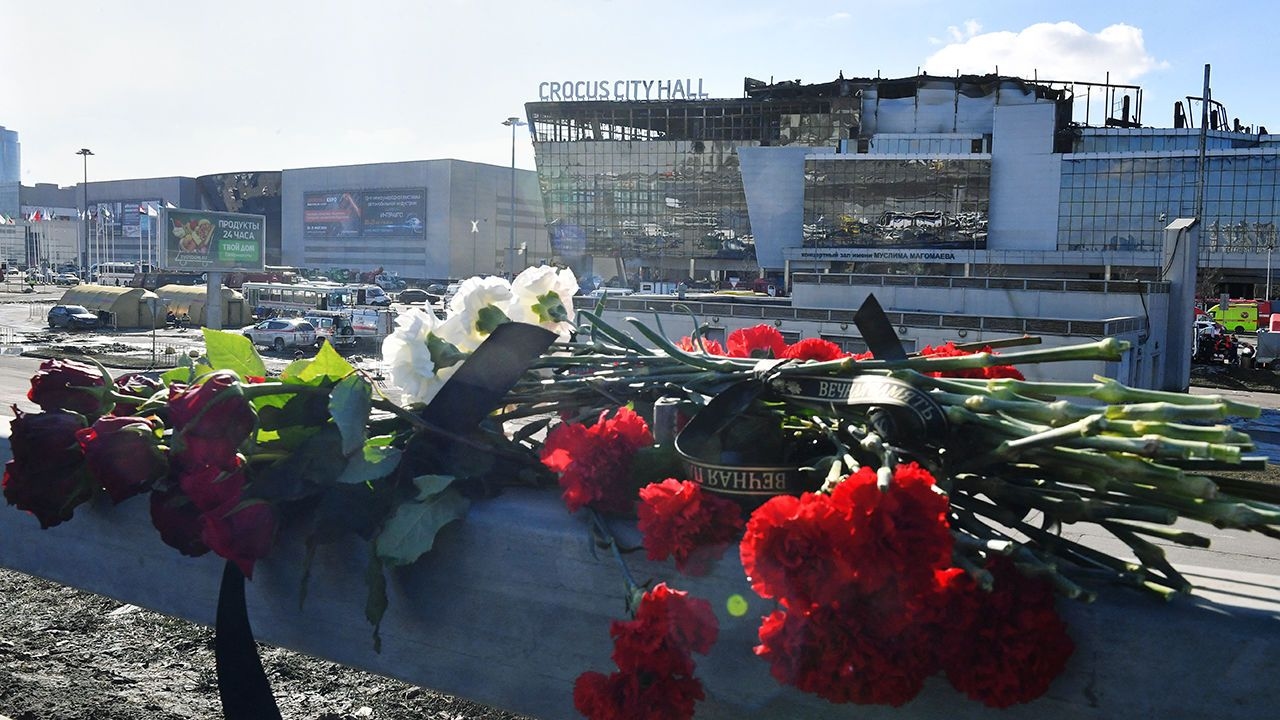 Flowers are seen left by the burnt-out Crocus City Hall concert venue in Krasnogorsk, outside Moscow