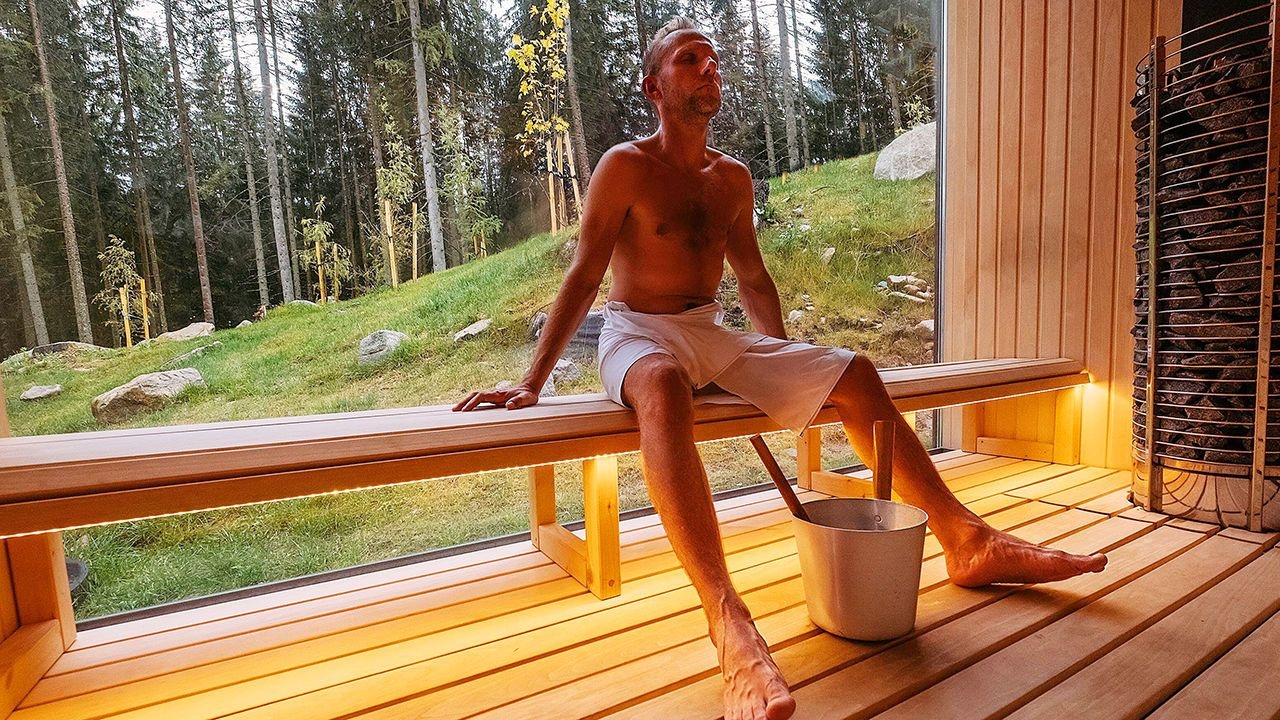 Man relaxing in Finnish sauna 