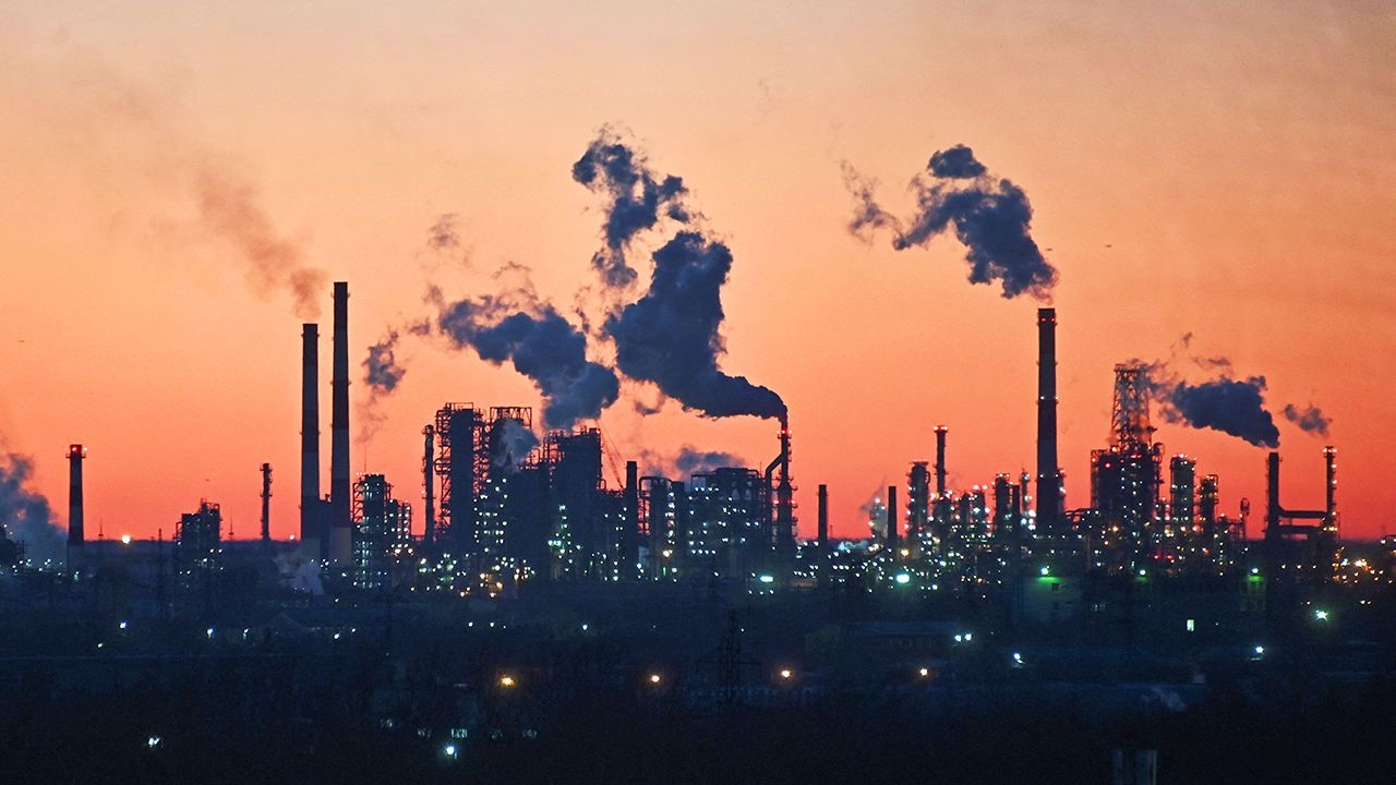An oil refinery during sunset in Omsk, Russia