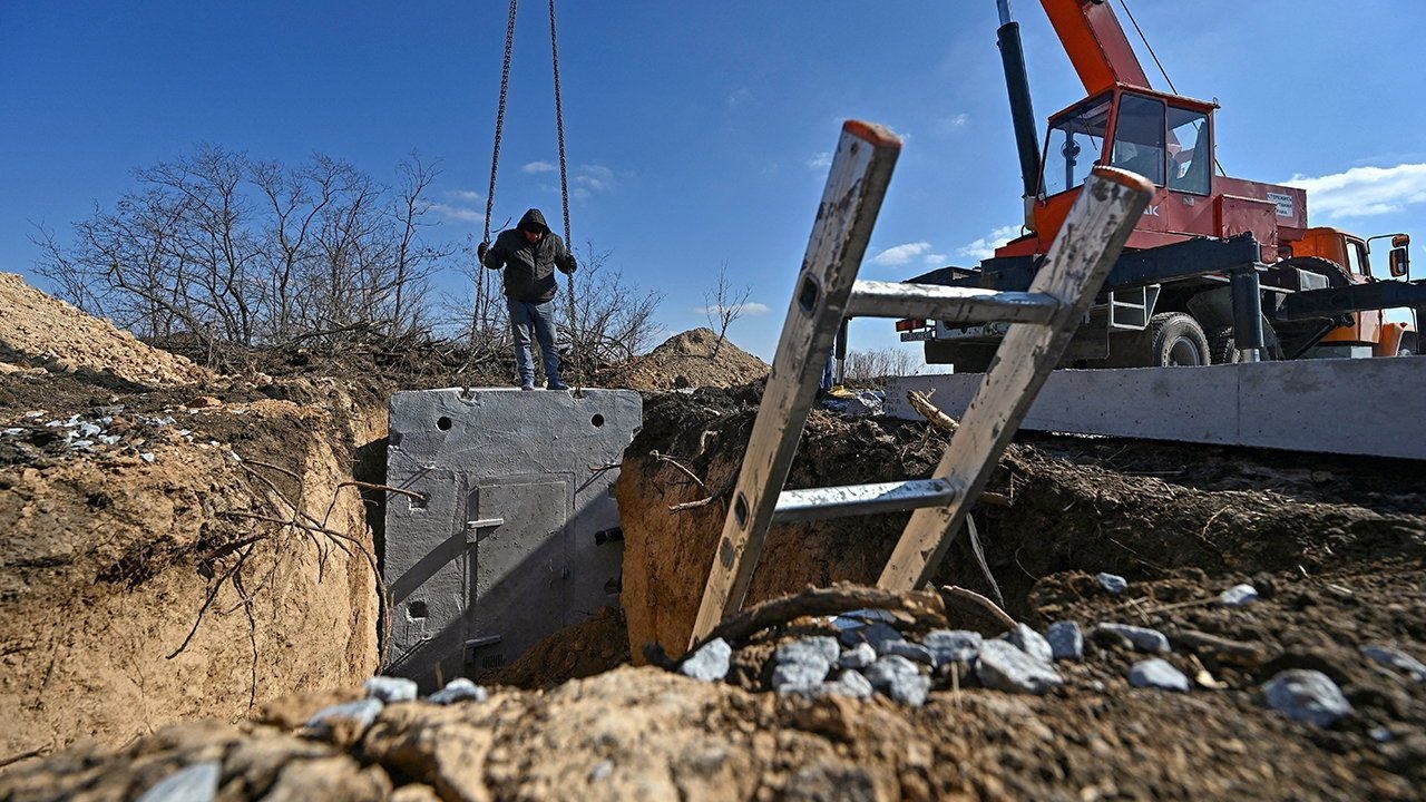Workers built a concrete dugout as part of a system of new fortifications, amid Russia's attack on Ukraine.