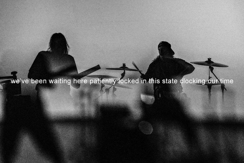 May be a black-and-white image of 2 people, cymbal and text that says "we've we ve been waiting here patiently locked in this state clocking our urtime time"