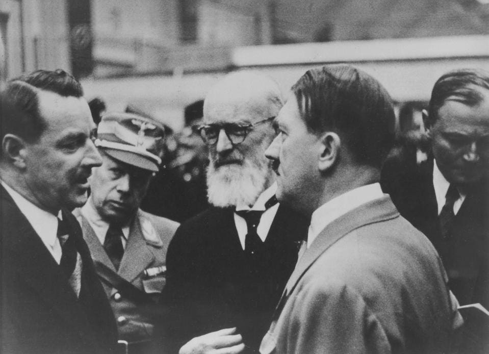 Robert Bosch (center) with Adolf Hitler (right). Despite supporting Jews throughout the war and opposing Hitler, 