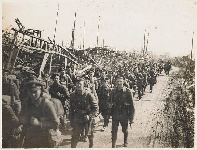 Soldiers of the Duke of Cambridge’s Own (Middlesex Regiment) moving up through Achiet-le-Petit, March 1918
