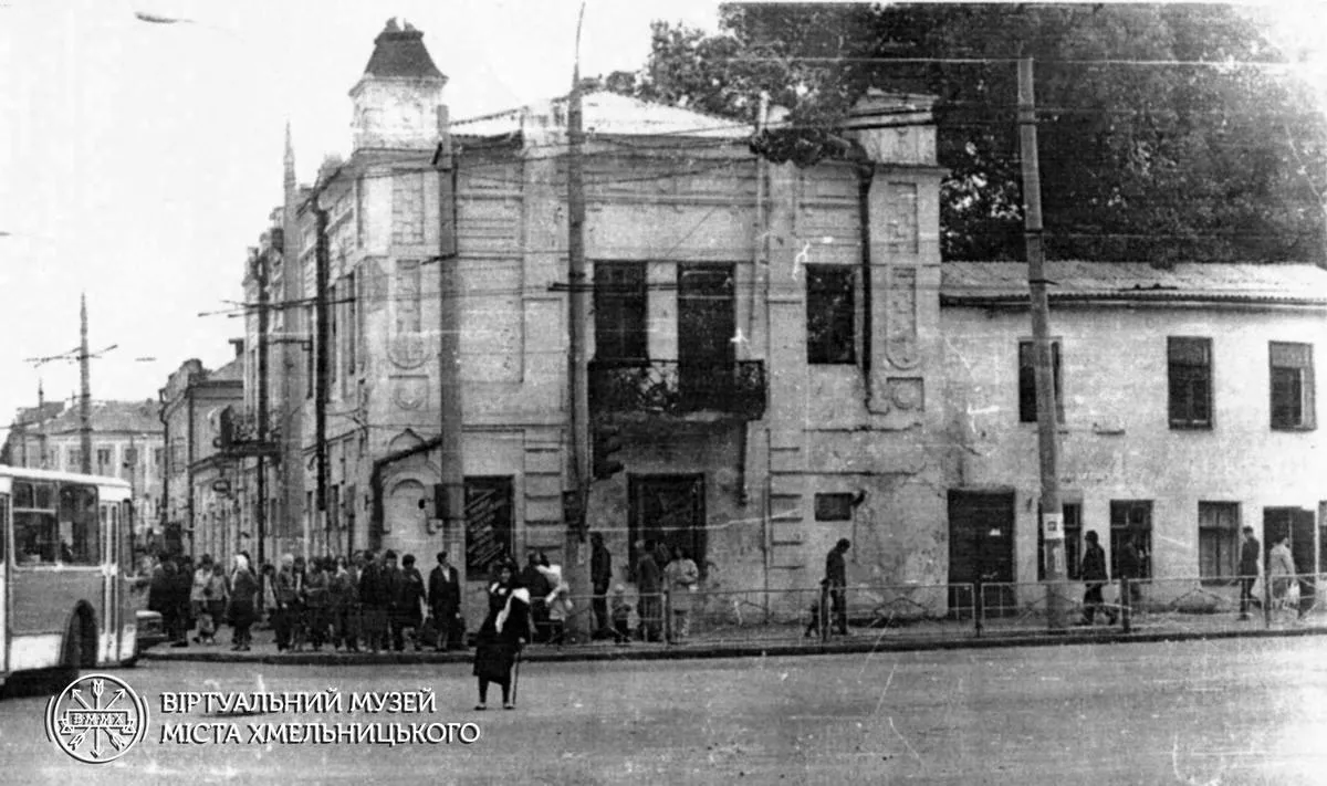 May be an image of trolley, bus, street and text