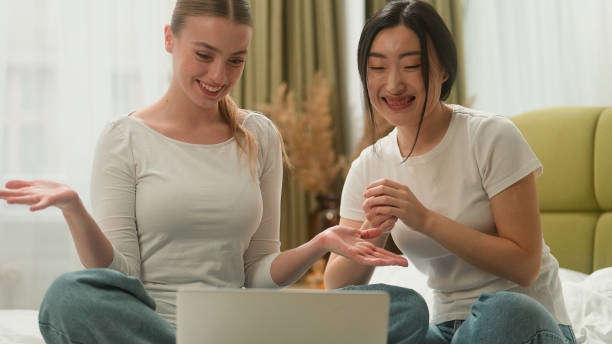 Happy smiling laughing excited multiethnic multiracial diversity two friends Caucasian Asian women girls female ladies laptop online discount rejoice win computer hug achieve high five yelling at bed Happy smiling laughing excited multiethnic multiracial diversity two friends Caucasian Asian women girls female ladies laptop online discount rejoice win computer hug achieve high five yelling at bed. High quality 4k footage Massage Republic Uncovered: Navigating the World of Online Adult Companionship in 2026 stock pictures, royalty-free photos & images