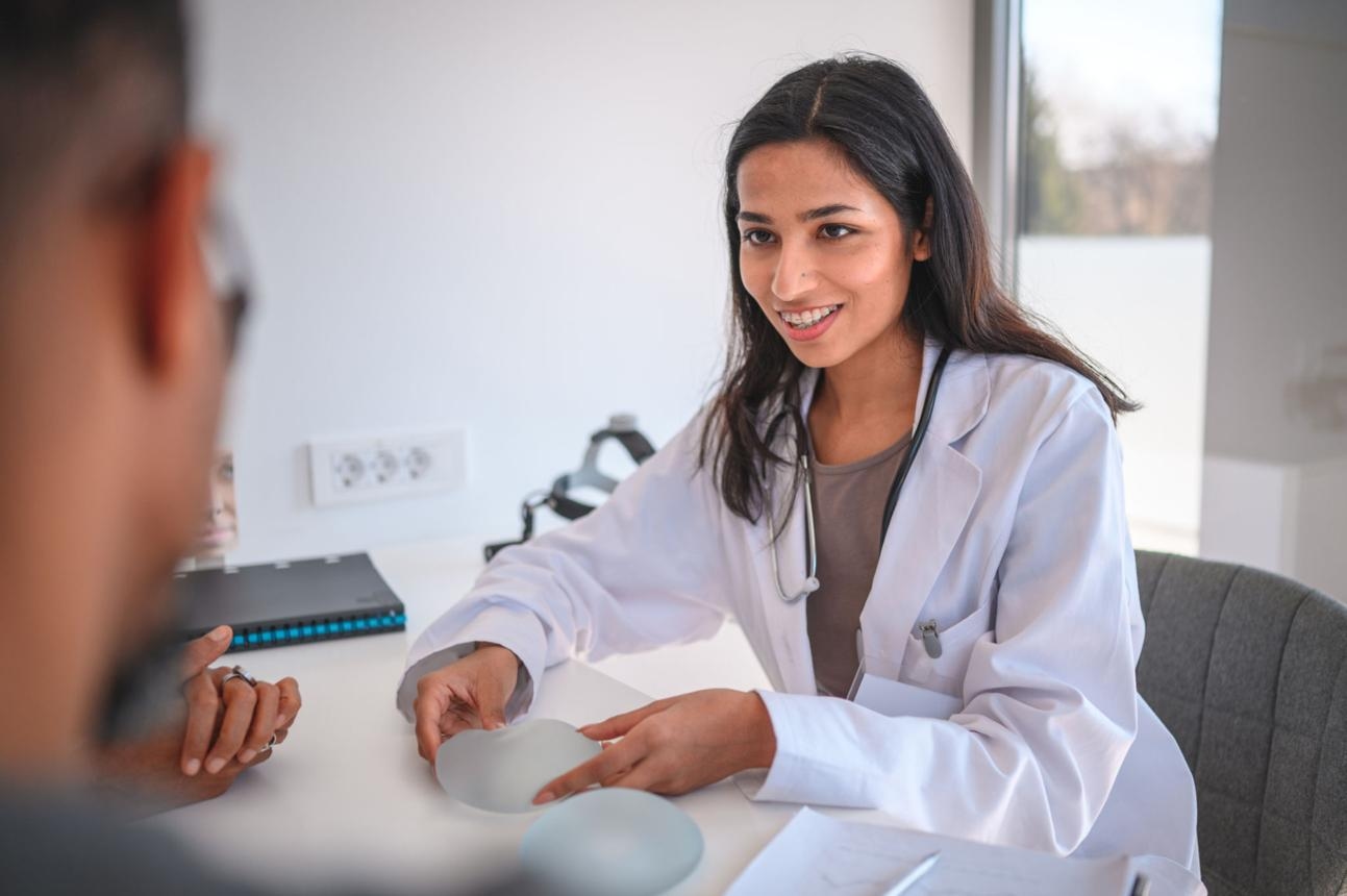 Indian Female Plastic Surgeon Holding a Breast Implant