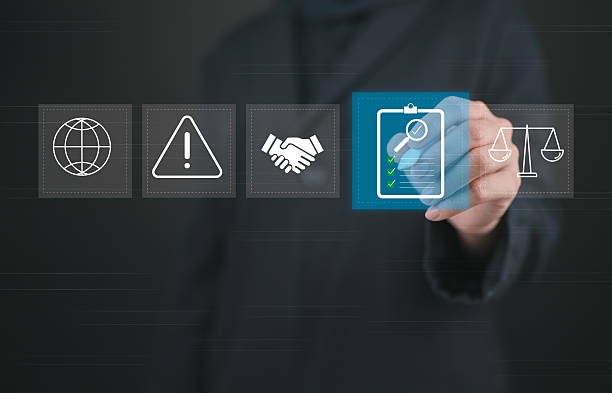 Compliance in business concept. Women with compliance icon on virtual screen, ensuring the enforcement of laws, regulations, and standards. Stay in line with business policies. Compliance in business concept. Women with compliance icon on virtual screen, ensuring the enforcement of laws, regulations, and standards. Stay in line with business policies. What Should You Include in a SAMA-Compliant Incident Response Plan stock pictures, royalty-free photos & images