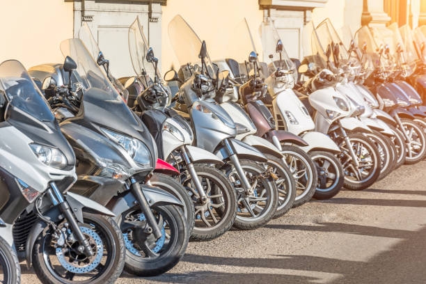 Row of scooters for sale and rental on the streets. Row of scooters for sale and rental on the streets motarbike rent stock pictures, royalty-free photos & images