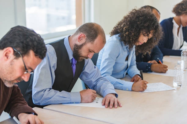 Adult Education Testing Adult Students Sitting an Exam CA Examination stock pictures, royalty-free photos & images